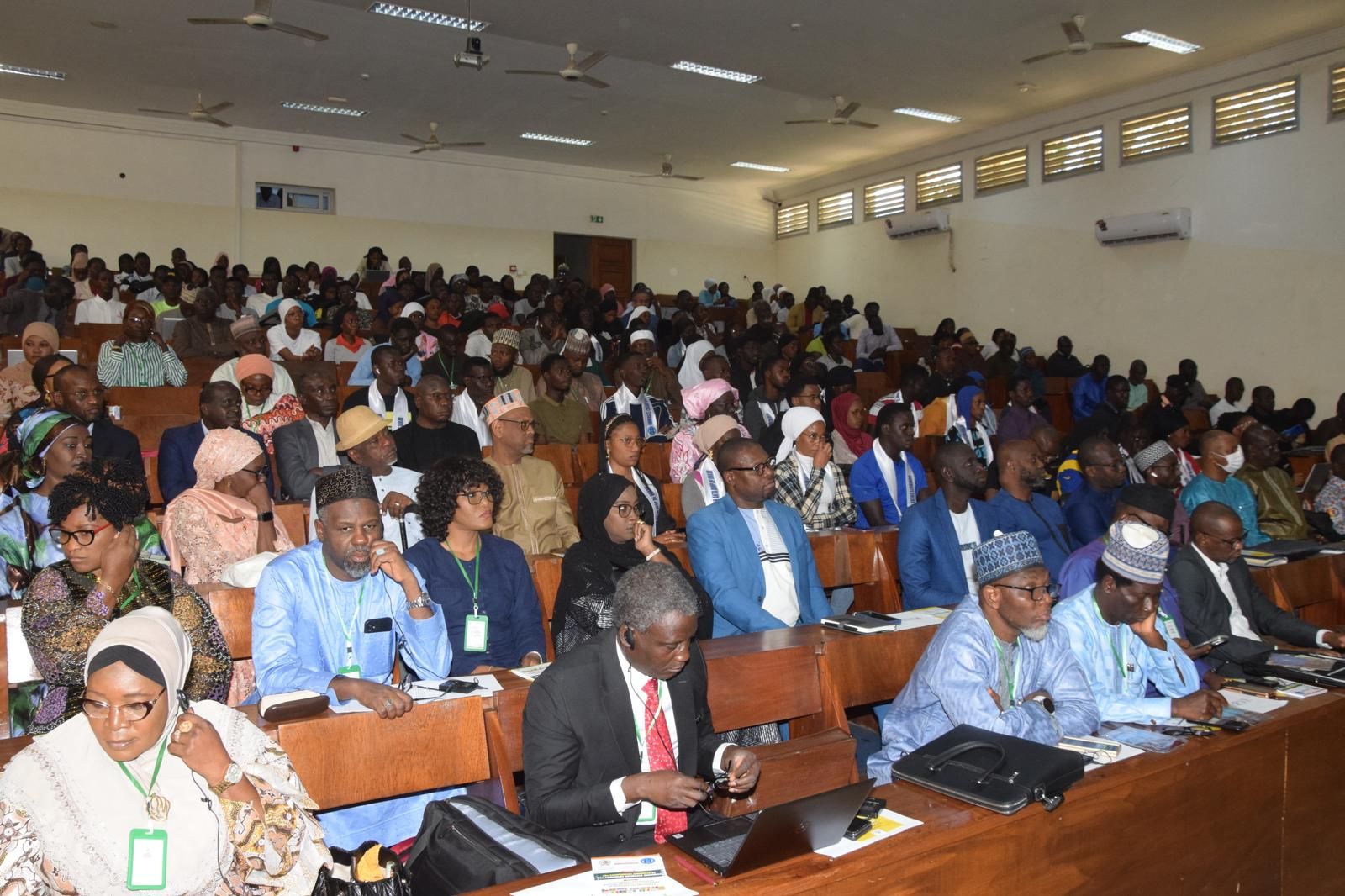 Participants at AWAU 2025 Conference in Dakar, Senegal, discussing AI and digital transformation in education.